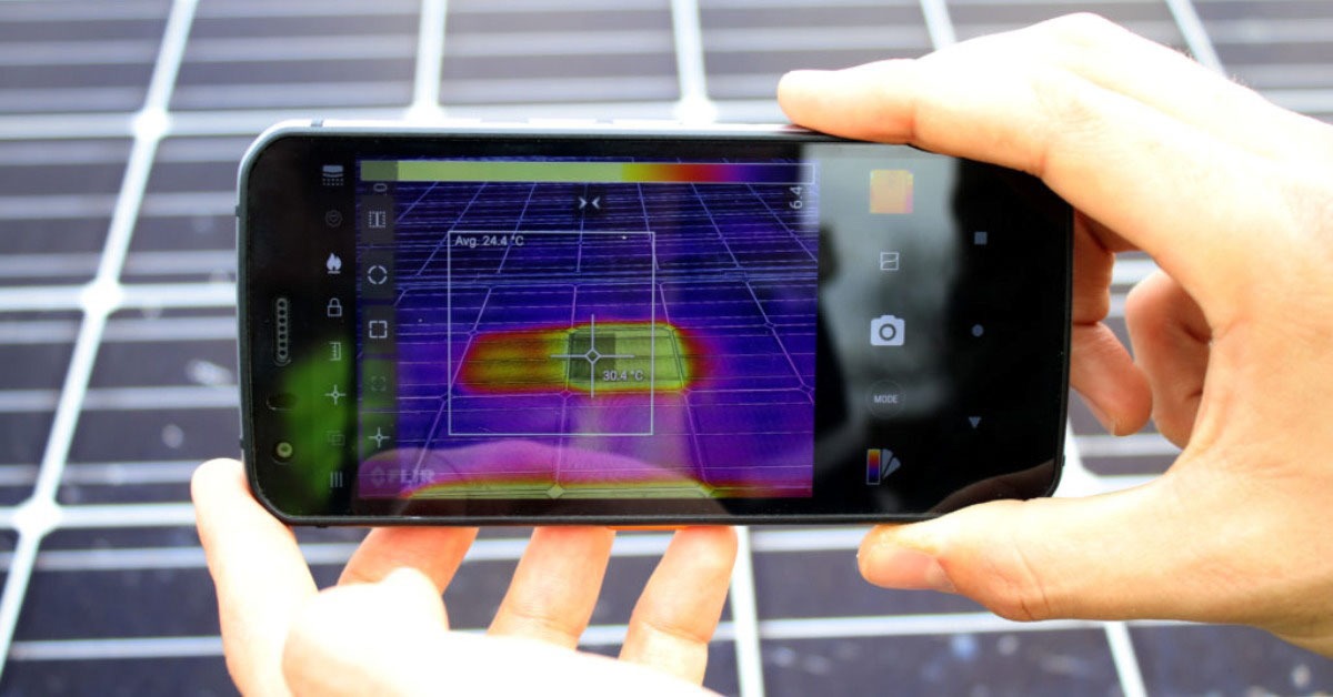 Hands holding mobile device looking at thermal imaging
